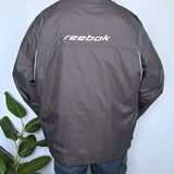 VINTAGE REEBOK SPELLOUT SPRAY JACKET - XL